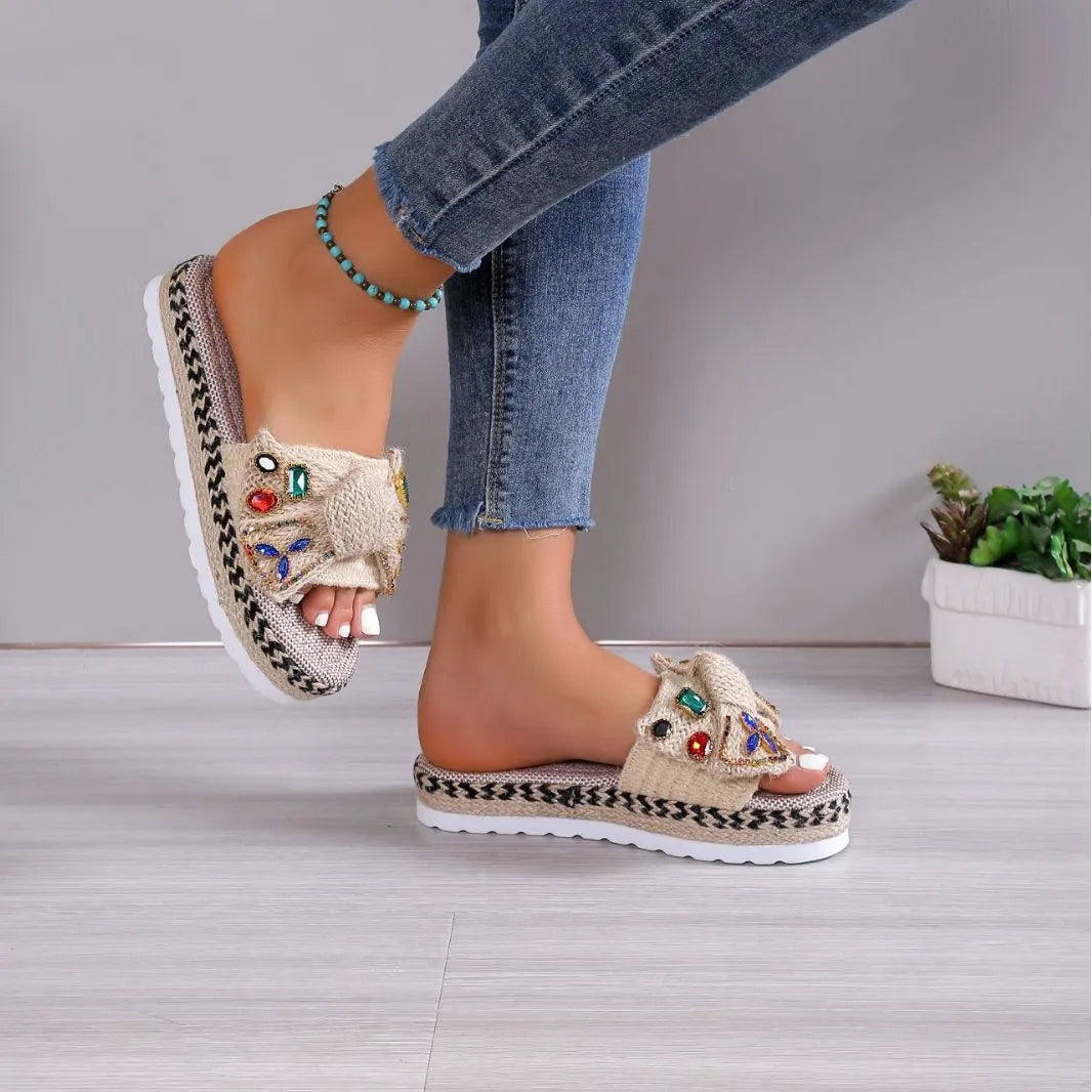 Women's beige platform sandals with bow detail, round toe and cloth upper, side view