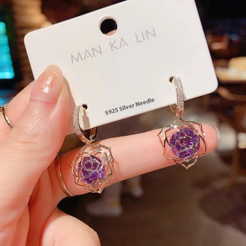 Geometric copper earrings with rose design elements and zircon detail in silver electroplated finish