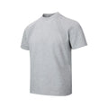 Man wearing a loose fit black short sleeve top with visible air layer stitching detail.