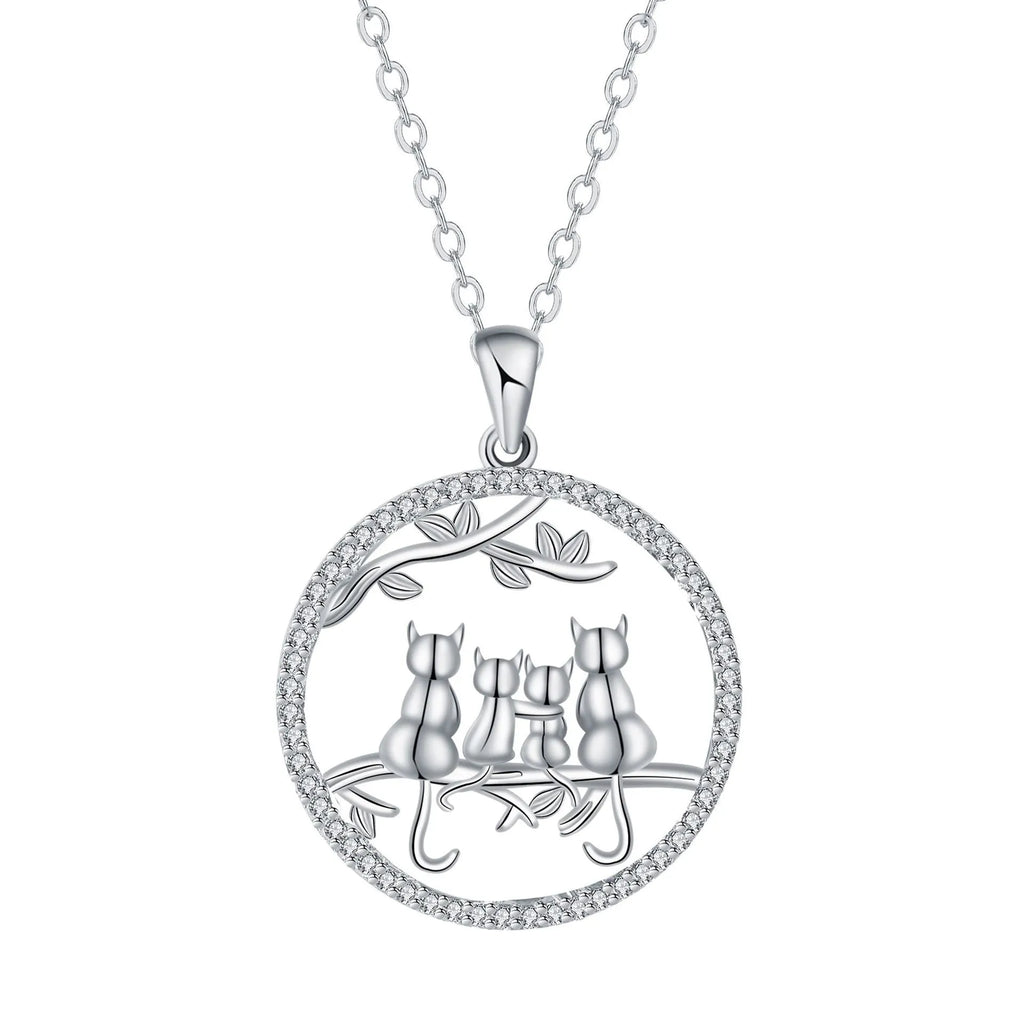 Four kitten pendant necklace on a copper cross chain with electroplated finish.