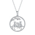 Four kitten pendant necklace on a copper cross chain with electroplated finish.
