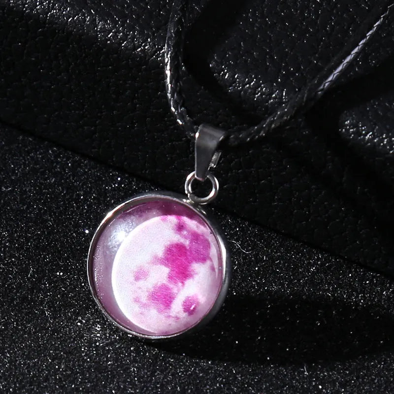 Luminous moon and constellation night sky pendant on an extendable alloy necklace chain.