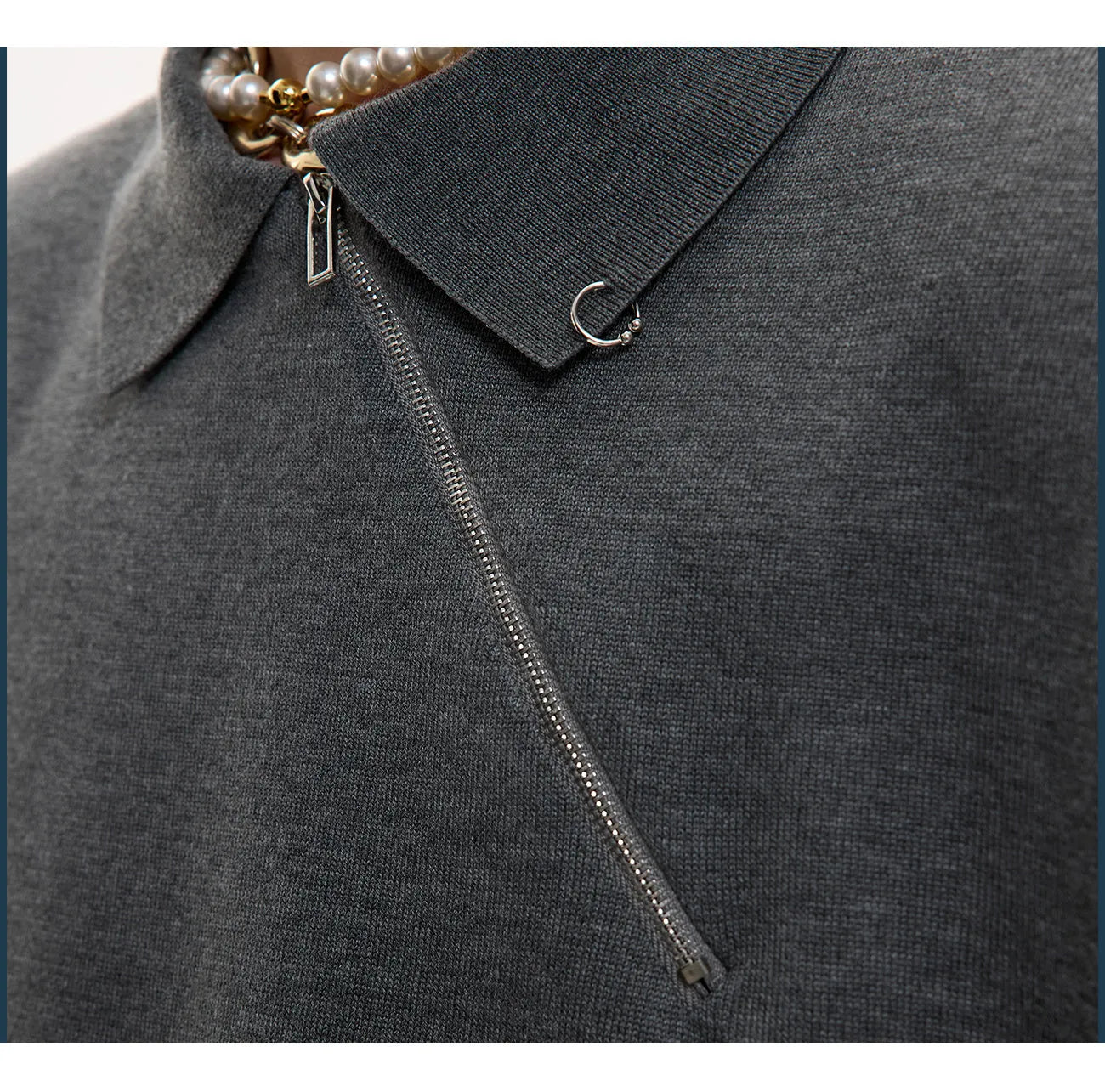 Men's black slim-fit knitted polo shirt with an oblique diagonal front zipper and lapel collar.