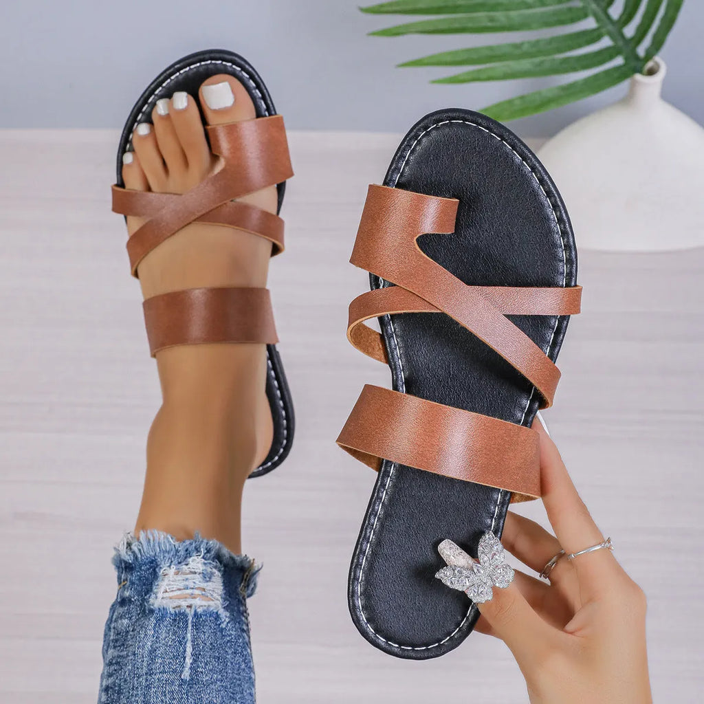 Round toe casual beach slippers with hollow out design on artificial PU upper.