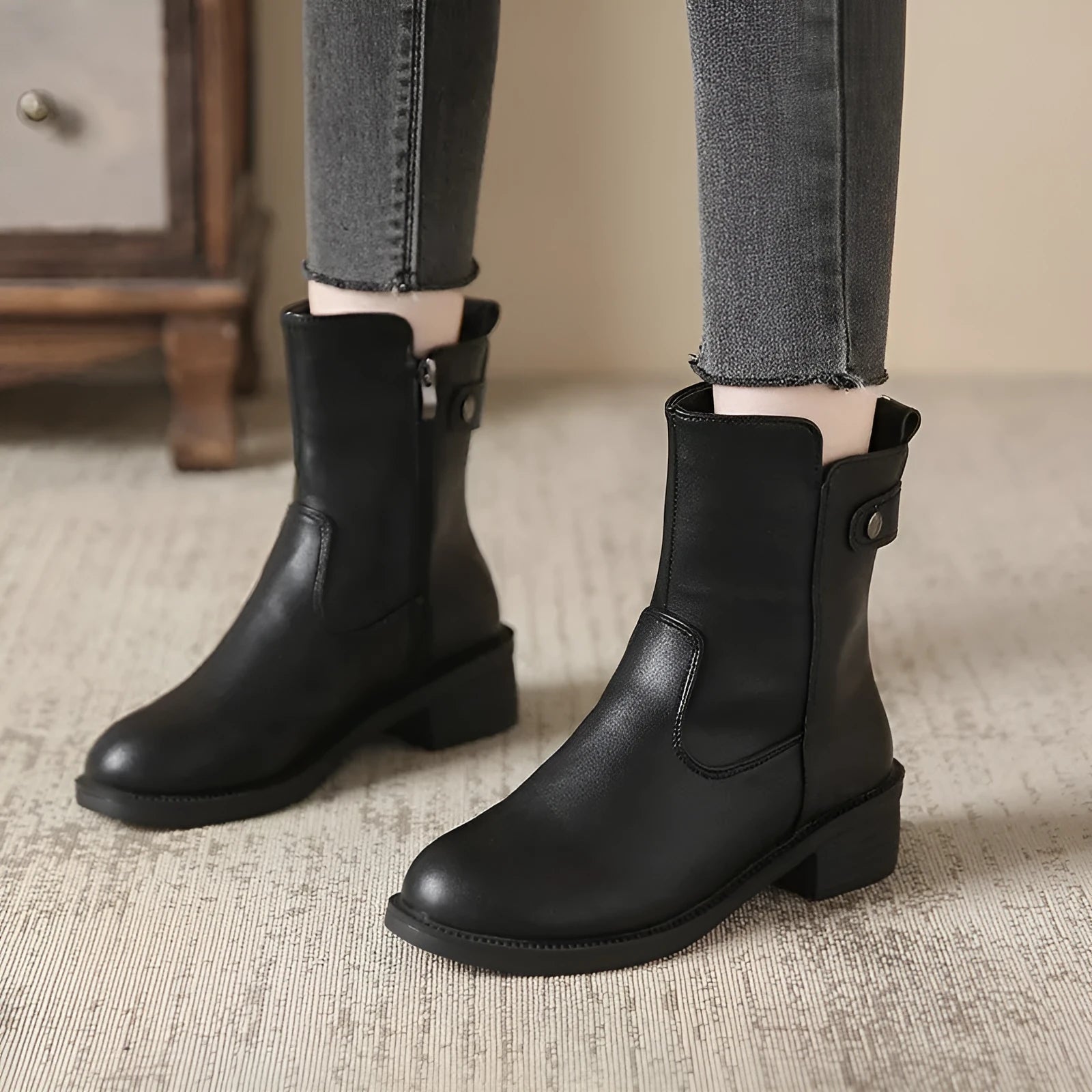 Women's black side zip low heel boots with round toe design