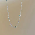 Square colour clavicle chain necklace with geometric crystal pendant in gold or white K finish.