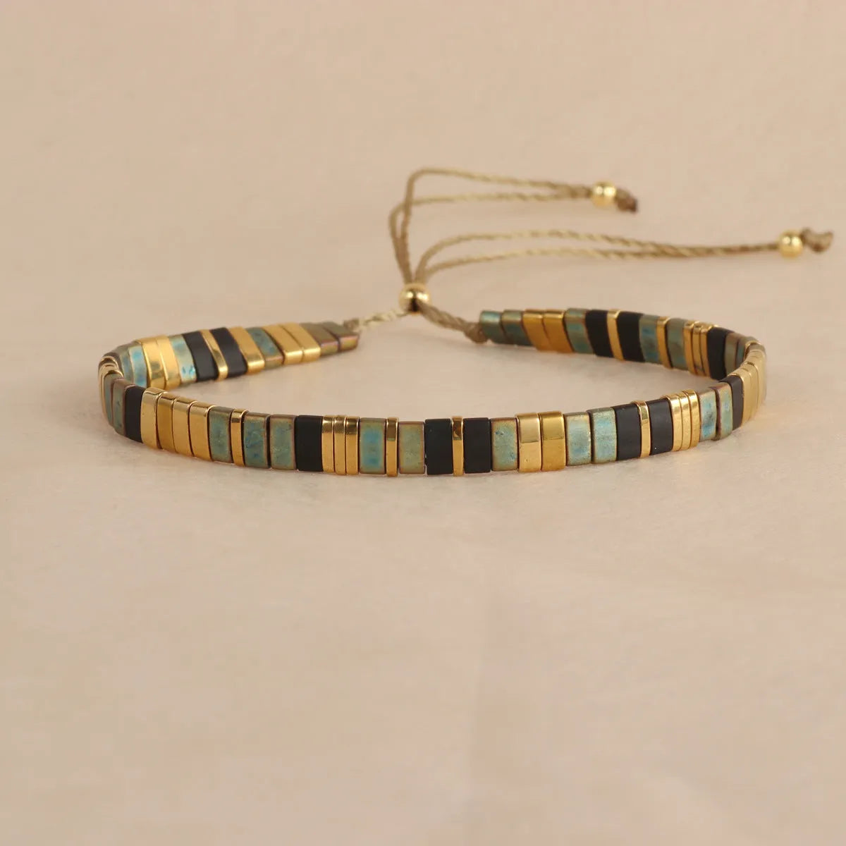 Geometric glass bead bracelet with pull adjustment in five colour options