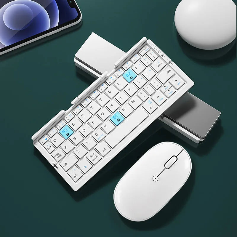 Silver white folding Bluetooth keyboard with integrated stand holding a smartphone