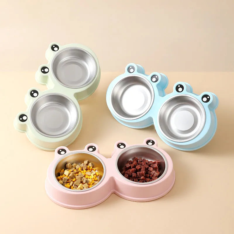 Stainless steel frog-shaped double pet bowl for food and water, available in blue, green, or pink.