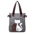 KVKY women canvas shoulder bag with cute plush cat applique in beige colour on white background