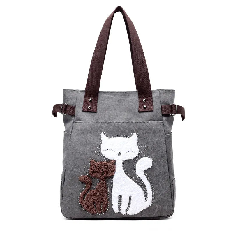 KVKY women canvas shoulder bag with cute plush cat applique in beige colour on white background