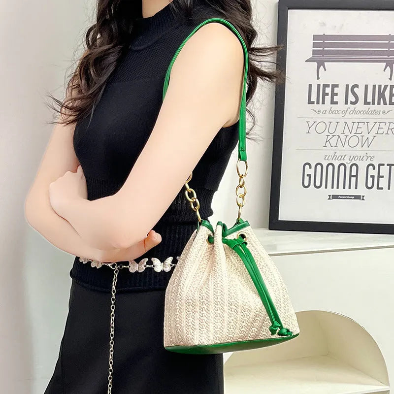 Straw woven women's crossbody shoulder bag with contrast colour trim and phone pocket