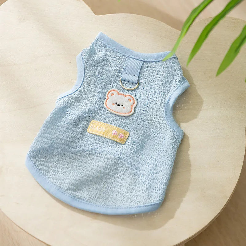 Cat wearing breathable hollowed-out knitted clothing with cartoon bear patch in blue colour