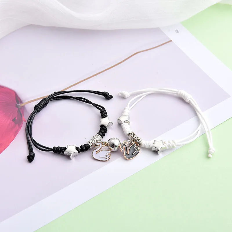 Alloy magnetic suction bracelet pair for couples with symbolic design options