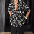 Black and white floral printed short sleeve shirt with loose fit cardigan style