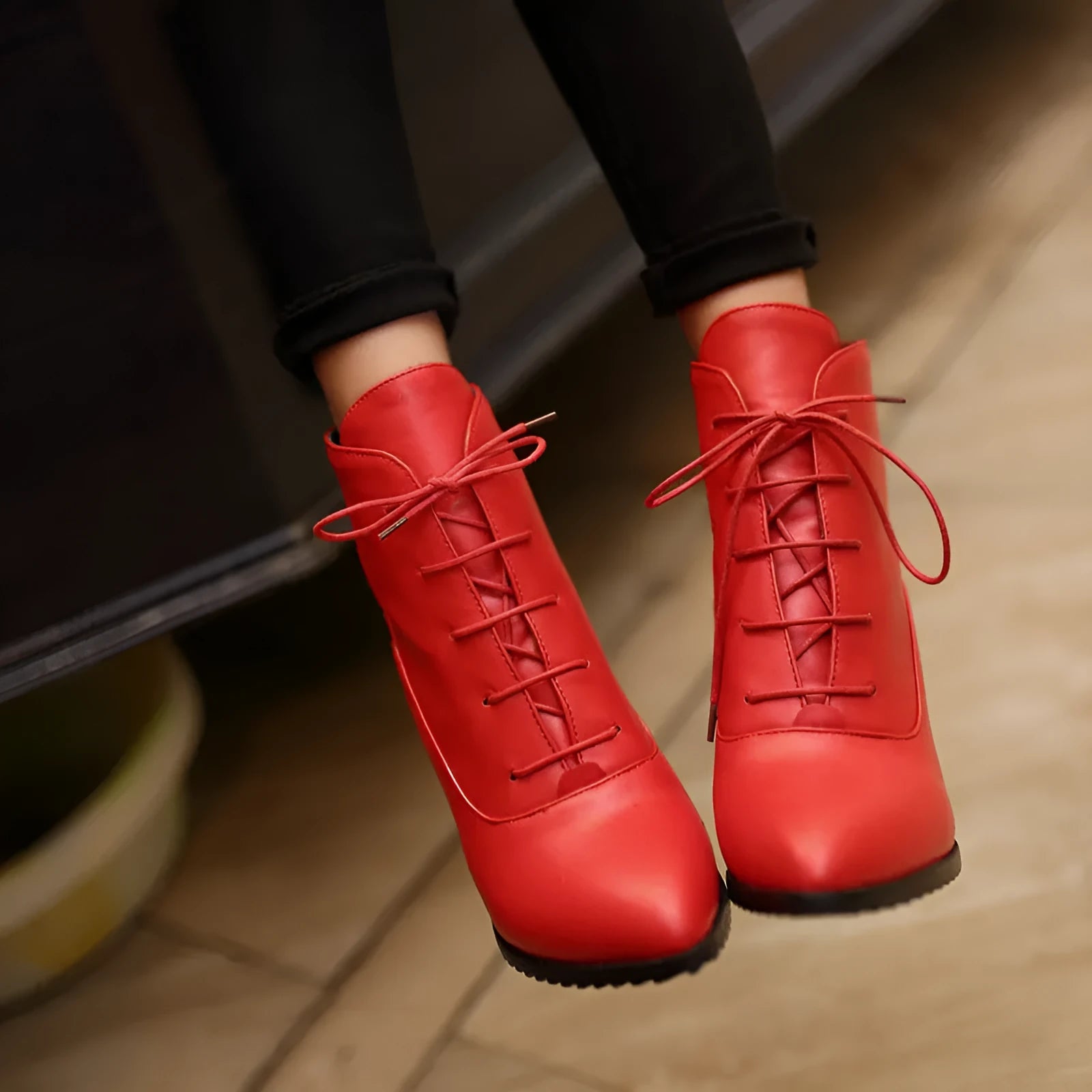 Women's lace-up Martin boots with stiletto heel in black, brown, and red
