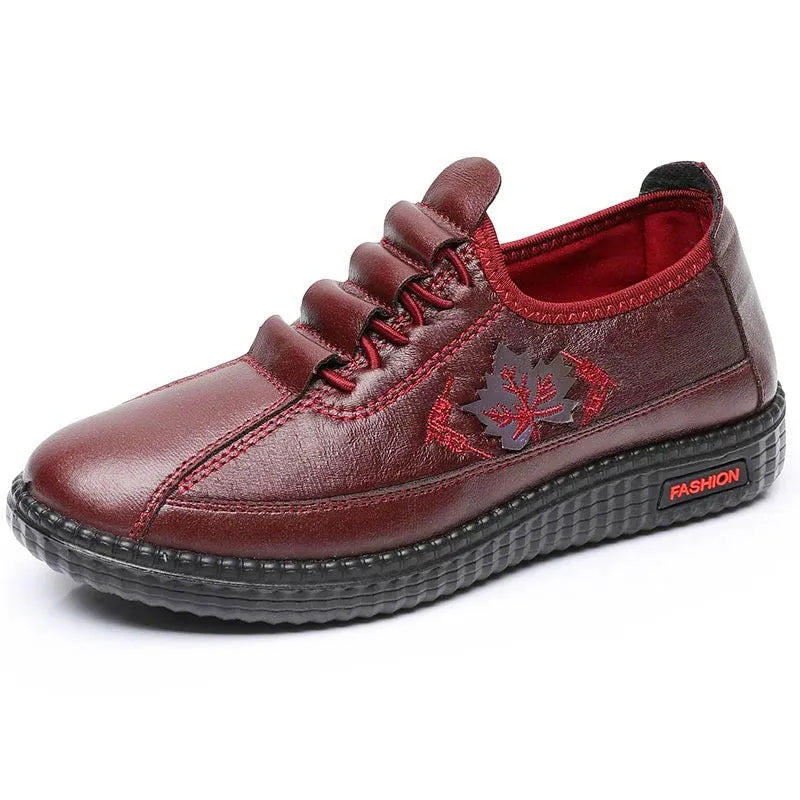 Plus size PU soft bottom slip-on mom shoes in black with leaf pattern, flat heel, and shallow mouth design