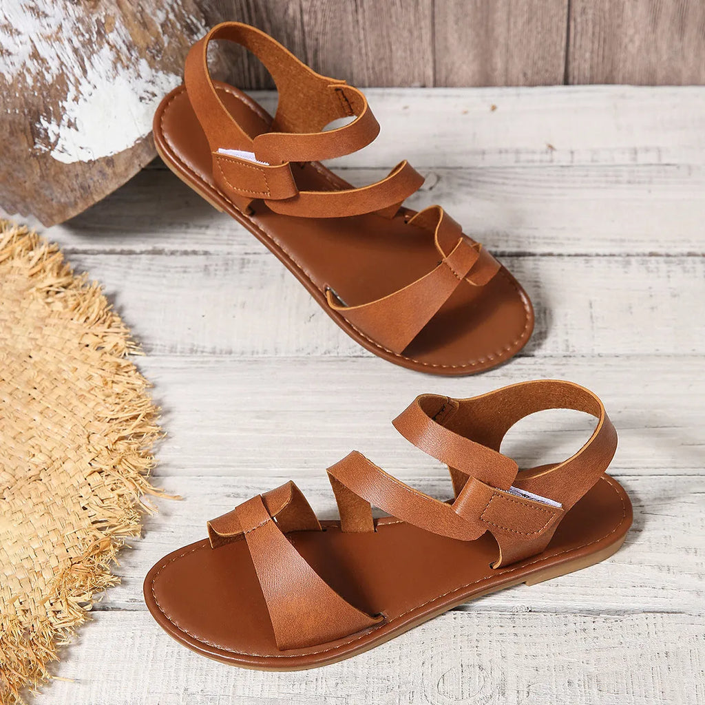 Women's black flat sandals with Velcro fastening and round toe design