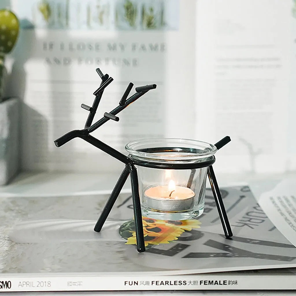 Wrought iron fawn-shaped candle holder with glass cup in gold electroplated finish
