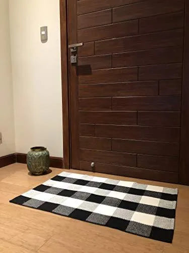 Cotton buffalo plaid rug in classic pattern on a light floor, showing non-slip backing