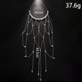 Gold and pearl mesh hair chain for women with a dangling tassel accessory.