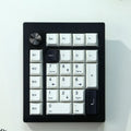 Black and white wireless mechanical Bluetooth numeric keypad with 24 keys