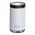 White USB humidifier with jellyfish spray mist effect and warm night light on a table.