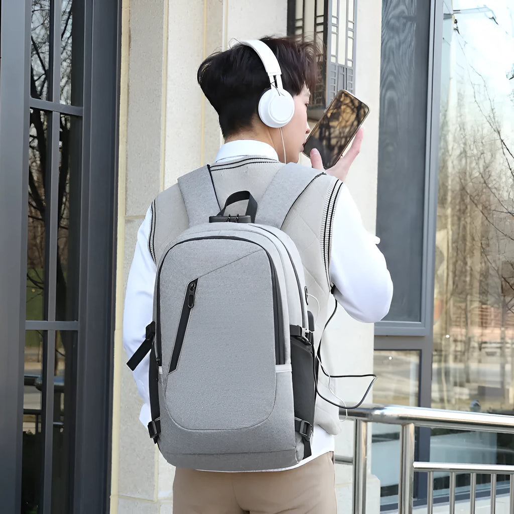 Oxford cloth casual backpack in blue, open to show interior, with a laptop inside.