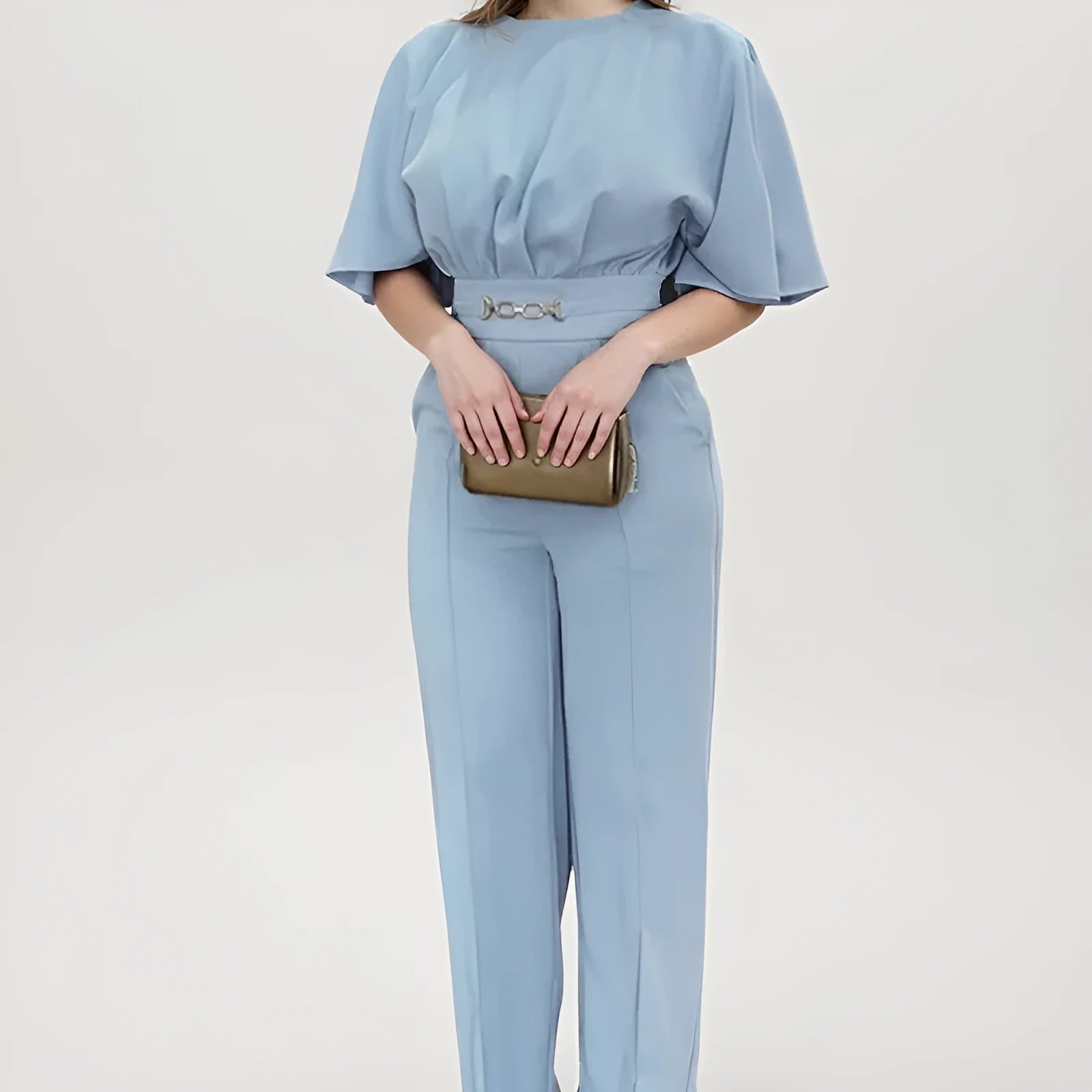 Blue men's two-piece polyester suit with jacket and trousers on a hanger