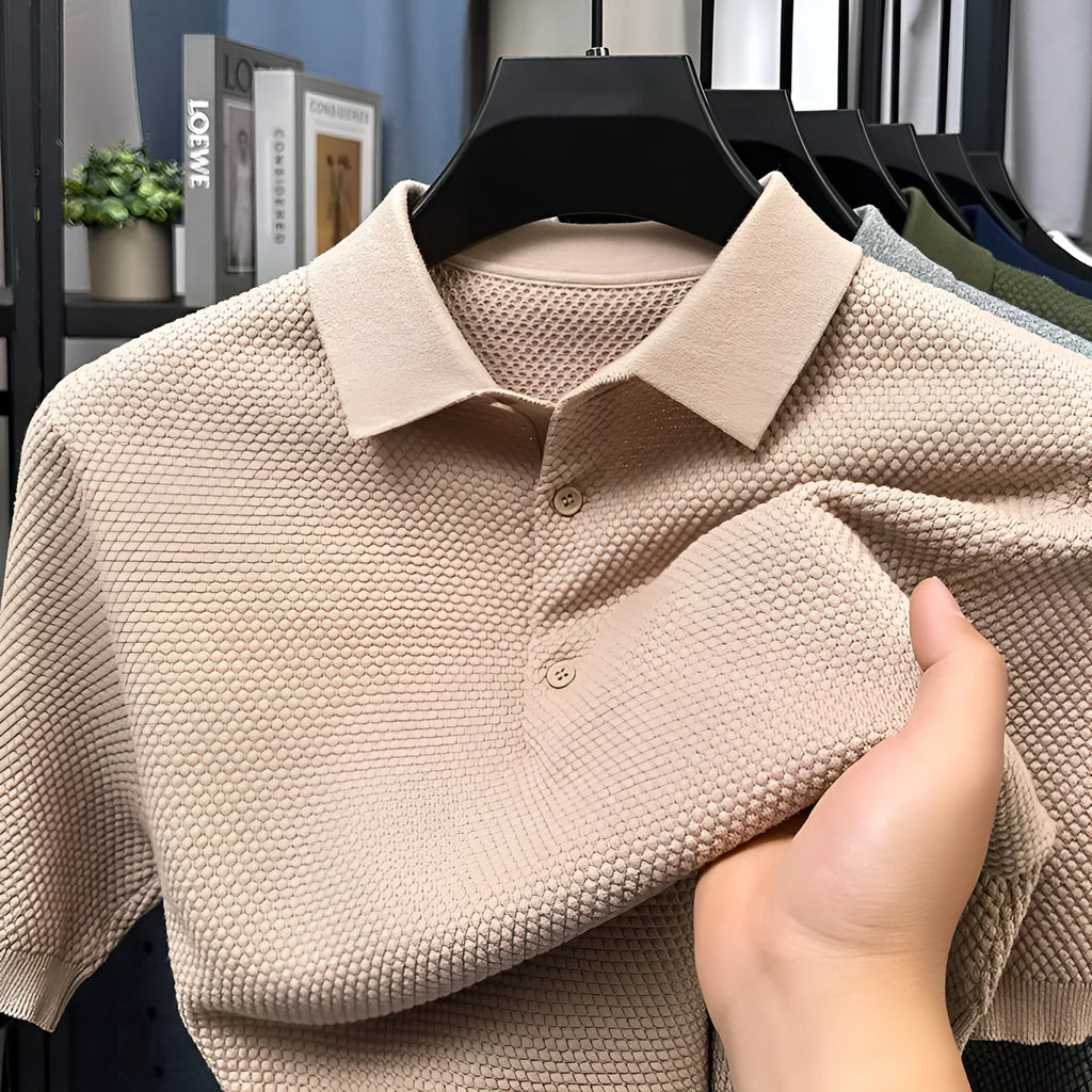 Loose fit grey cotton short sleeve pullover sweater laid flat.