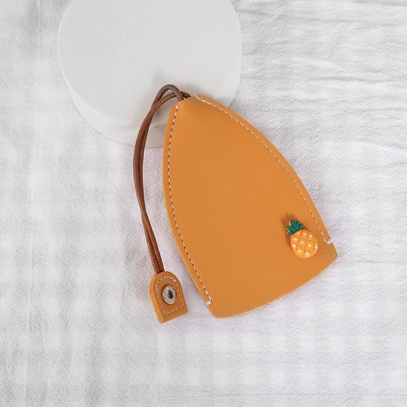Cartoon design pull-out key case for car keys in PU leather.