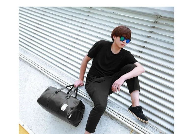 Black waterproof sports bag with shoe compartment and diagonal straps shown in two size options
