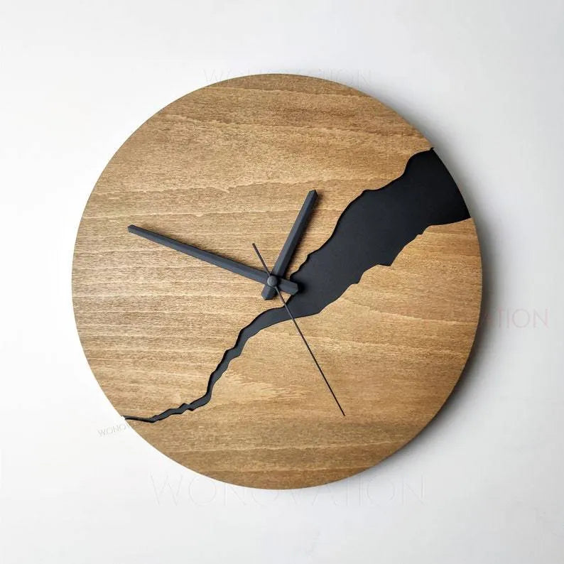 Modern round wooden wall clock with a cracked finish, 30cm in diameter.