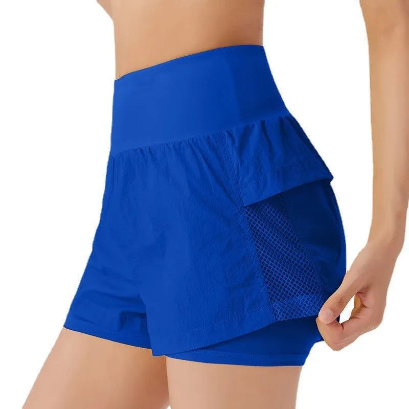 Women's loose casual quick-drying sports shorts in a cotton blend fabric on a hanger.