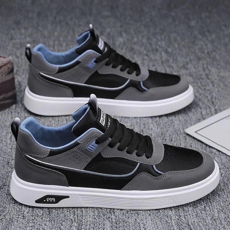 Men's low-top canvas board shoes in solid colour with leather stitching detail on a neutral background.