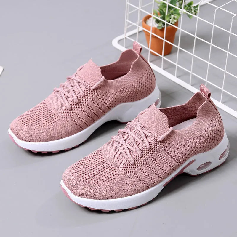 Women's solid colour mesh sneaker with round toe and lace-up front, on a non-slip PVC sole.