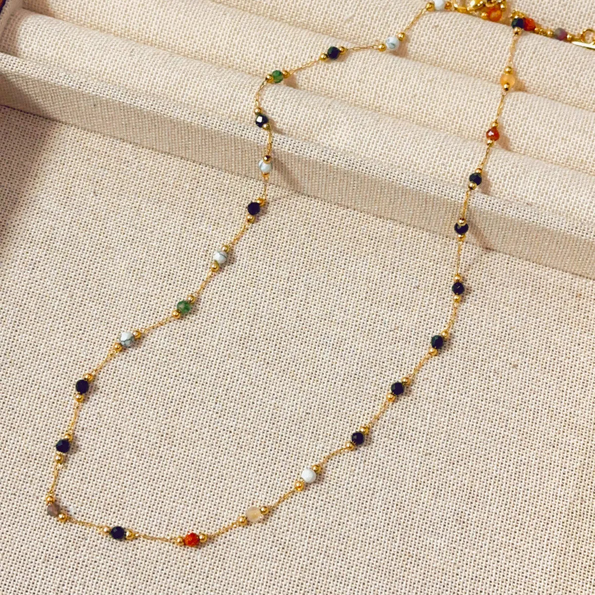 Gold titanium steel necklace with a natural stone pendant on an adjustable O-ring chain.