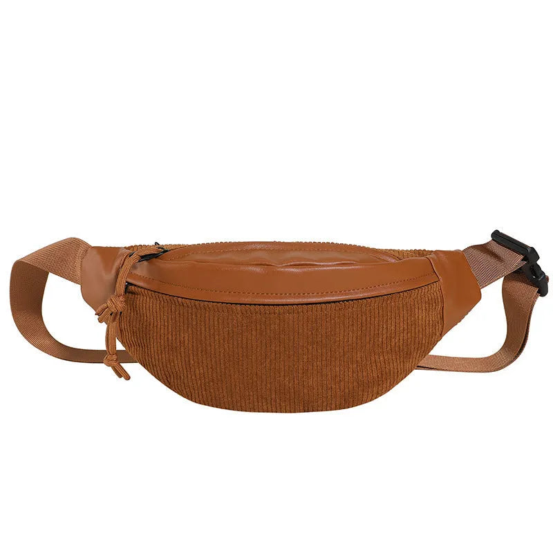 Corduroy crossbody bag in oval shape with brown colour, slit outer pocket, and crossbody strap for daily use