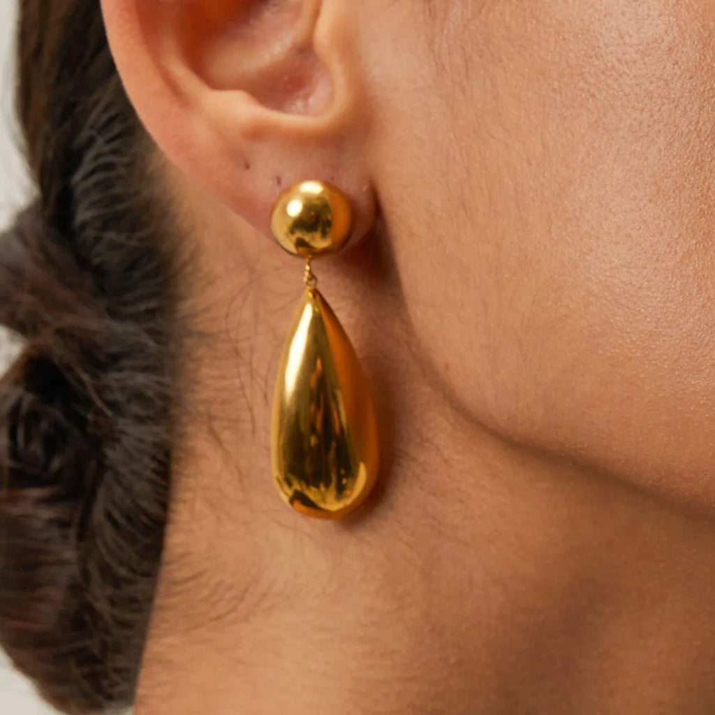 Gold electroplated stainless steel water drop earrings with geometric hemisphere design