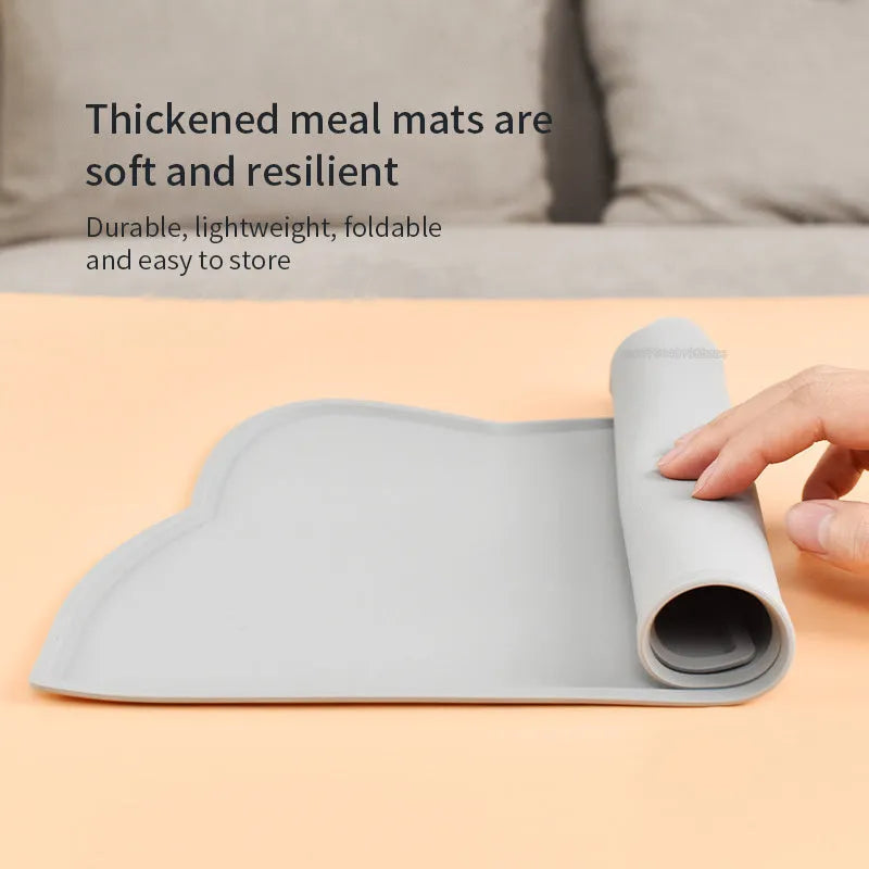 Solid colour silicone pet feeding mat placed under dog bowl on floor