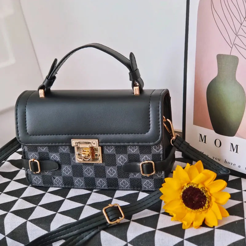 Small square retro pattern crossbody bag in PU leather with floral stitching.