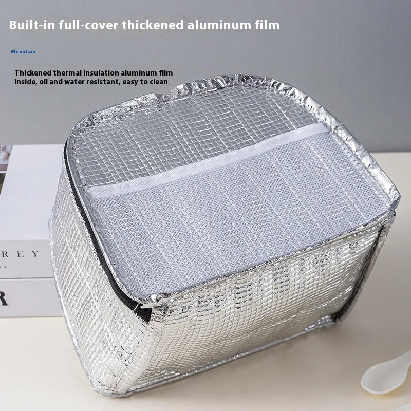 Insulated textured cloth lunch box bag in sapphire blue colour, shown with a lunch box inside.