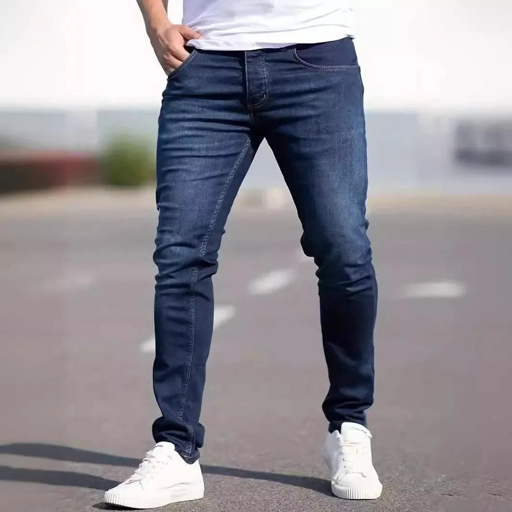 Men's dark blue slim street fashion jeans with mid waist and zipper fly