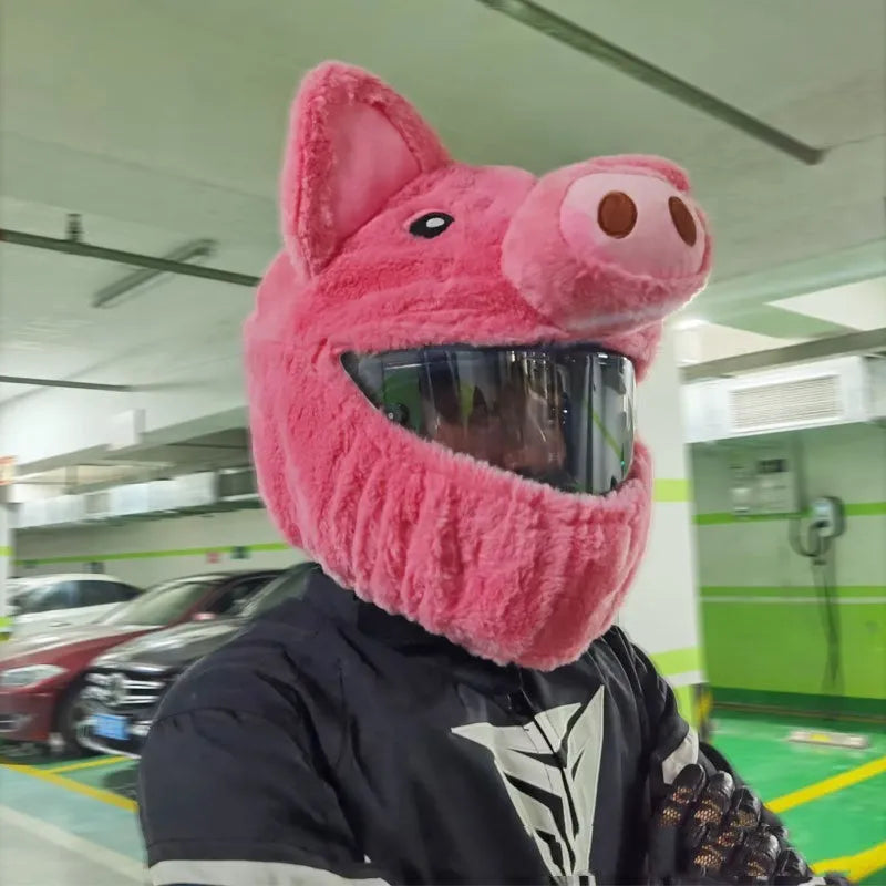 Pink pig cartoon plush helmet protective hood for motorcycle helmets with matching sleeve.