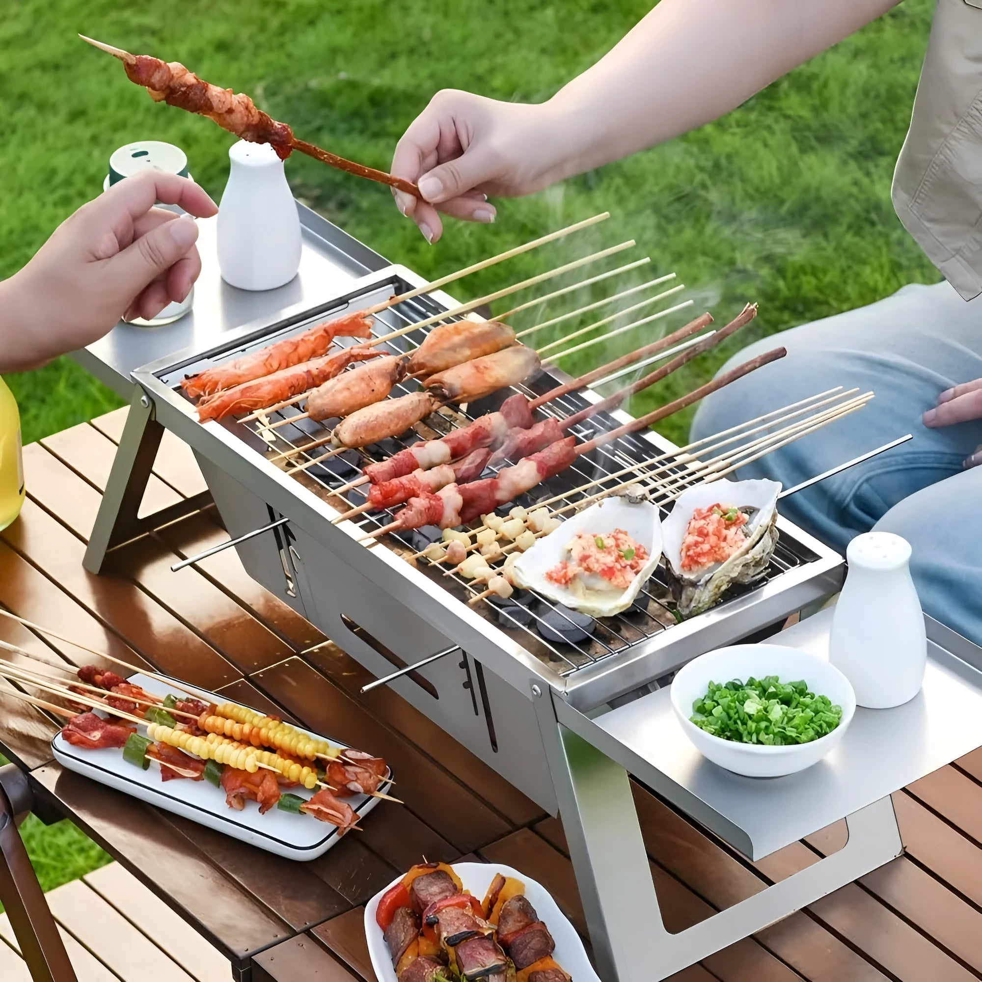 Small foldable portable charcoal grill with 34cm circular cooking surface collapsed for compact storage