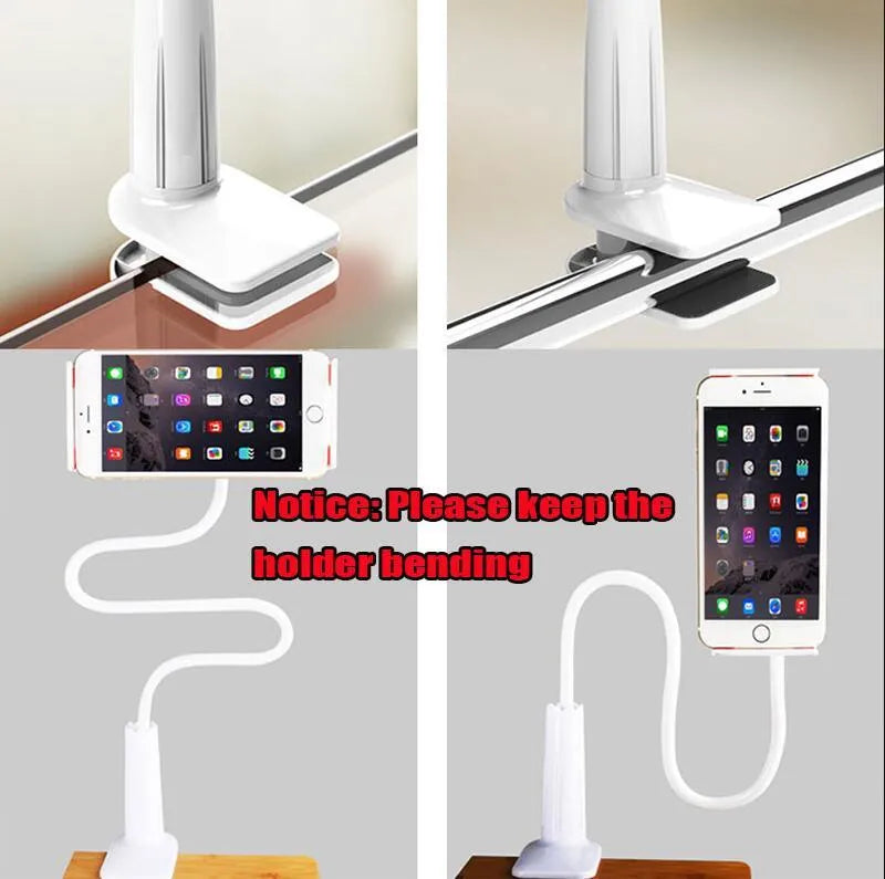 Black bedside oversize flat panel mobile phone stand with long flexible arm extended on a wooden table.