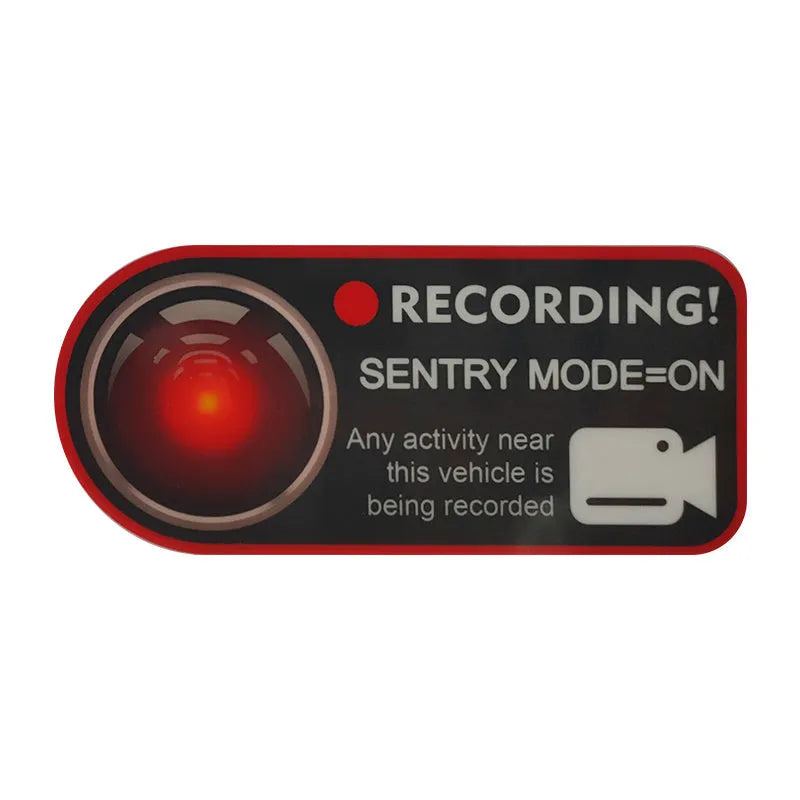Pair of white electrostatic warning stickers for Tesla Sentry Mode on a car window.