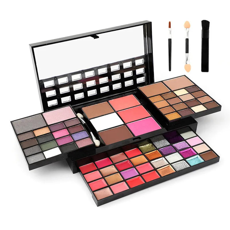 74 colour makeup palette set open showing four layers of eyeshadows, lip glosses, blushes, and contour powders with brushes