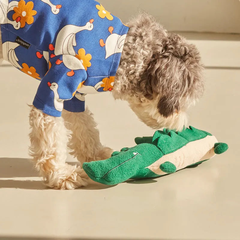 Green soft fabric plush dog toy shown on a white background.