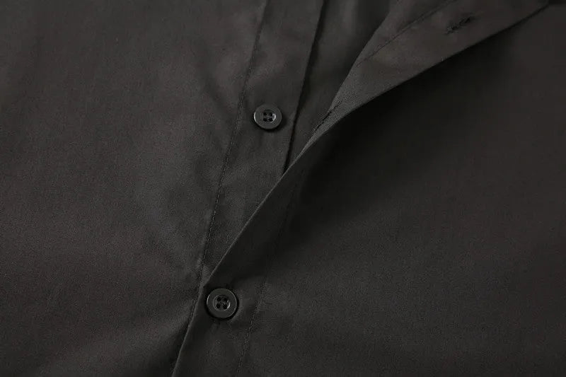 Teenage men's black stand-up collar shirt with fitted silhouette, shown front view, plain background.